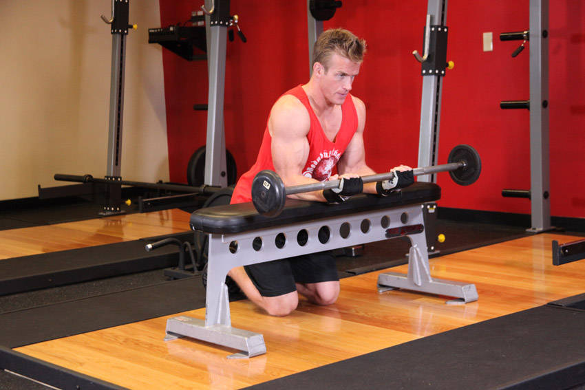 Palms-Up Barbell Wrist Curl Over A Bench, end position