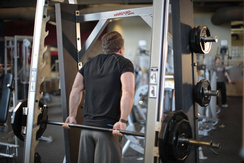 Smith Machine Behind the Back Shrug, end position