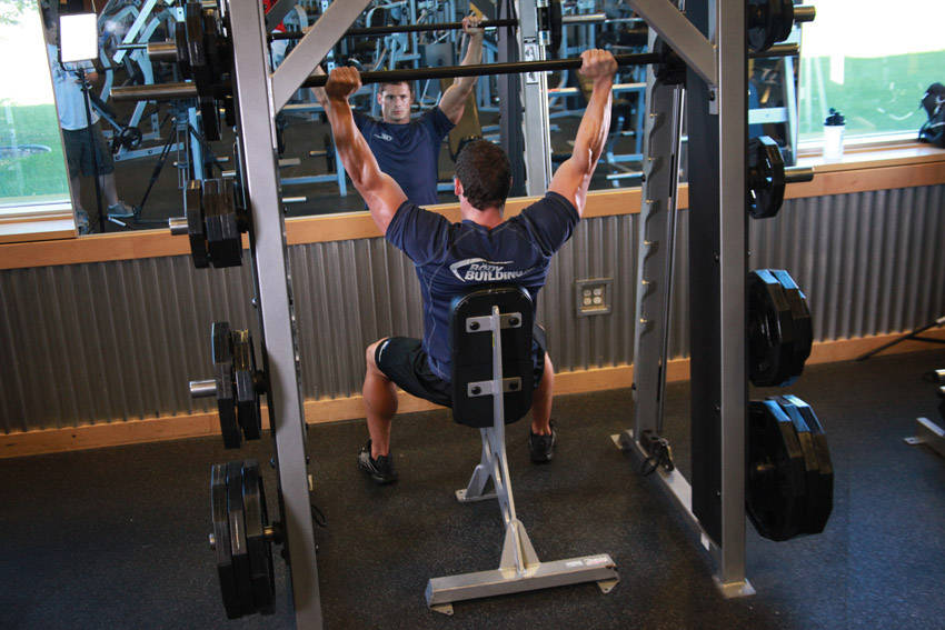 Smith Machine Overhead Shoulder Press, end position