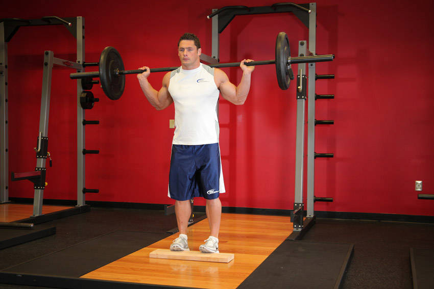 Standing Barbell Calf Raise, end position