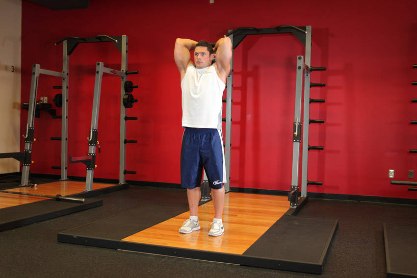 Standing Dumbbell Triceps Extension, end position