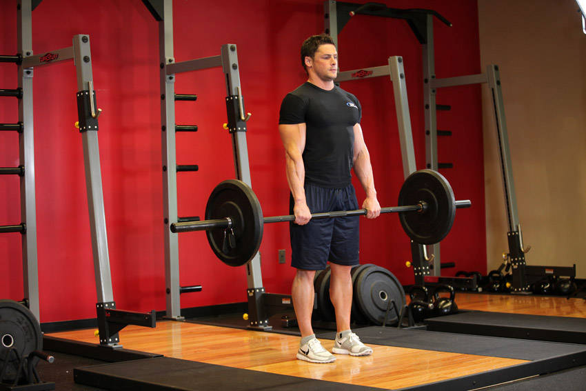 Stiff-Legged Barbell Deadlift, end position
